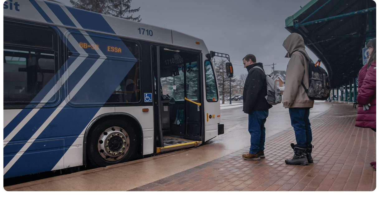 Riders wait at a Barrie Transit bus stop