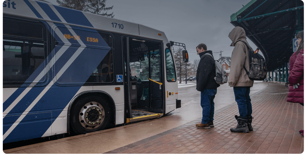 Riders wait at a Barrie Transit bus stop