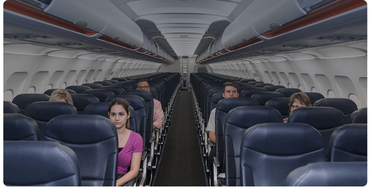 A passenger seated in an airplane cabin