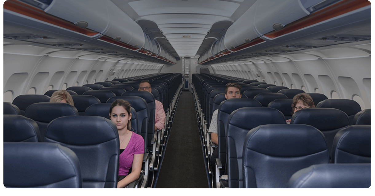 A passenger seated in an airplane cabin
