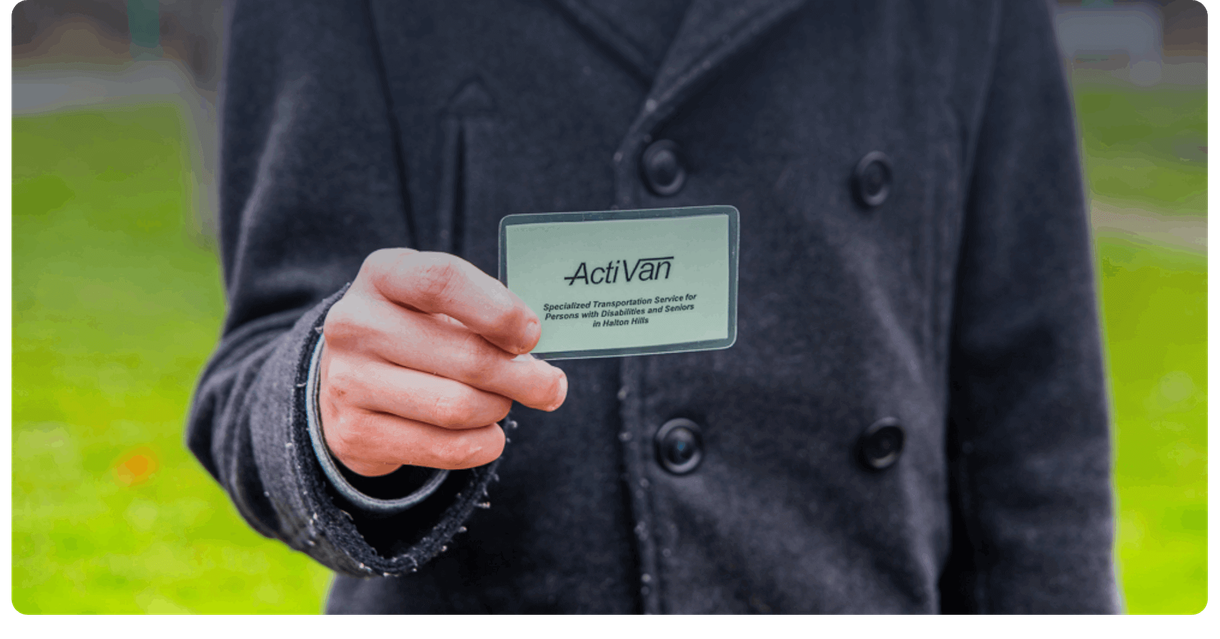 A hand holding an ActiVan card