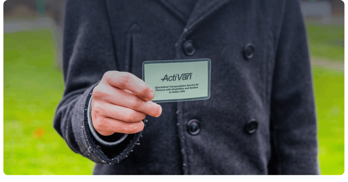 A hand holding an ActiVan card