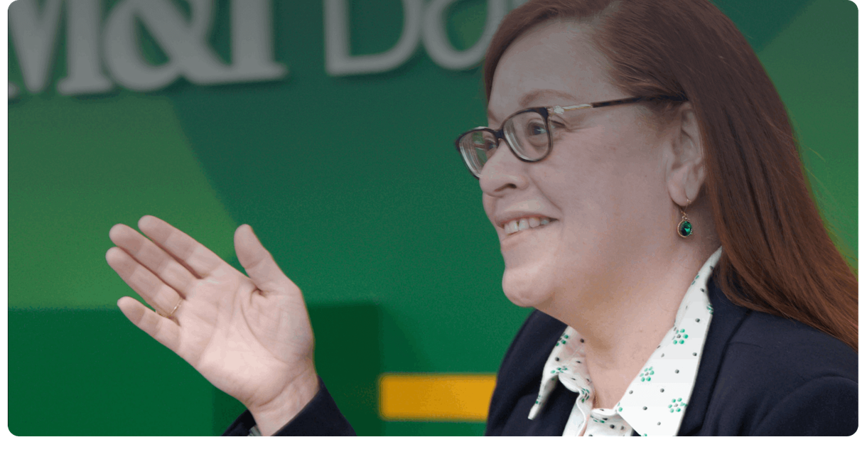 An M&T Bank teller greets a customer