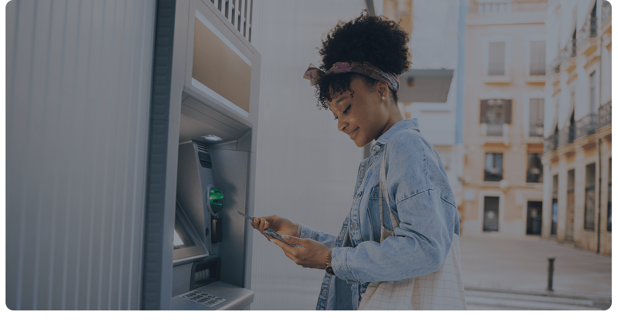 A customer uses her card at an ATM