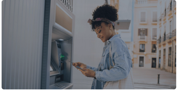 A customer uses her card at an ATM