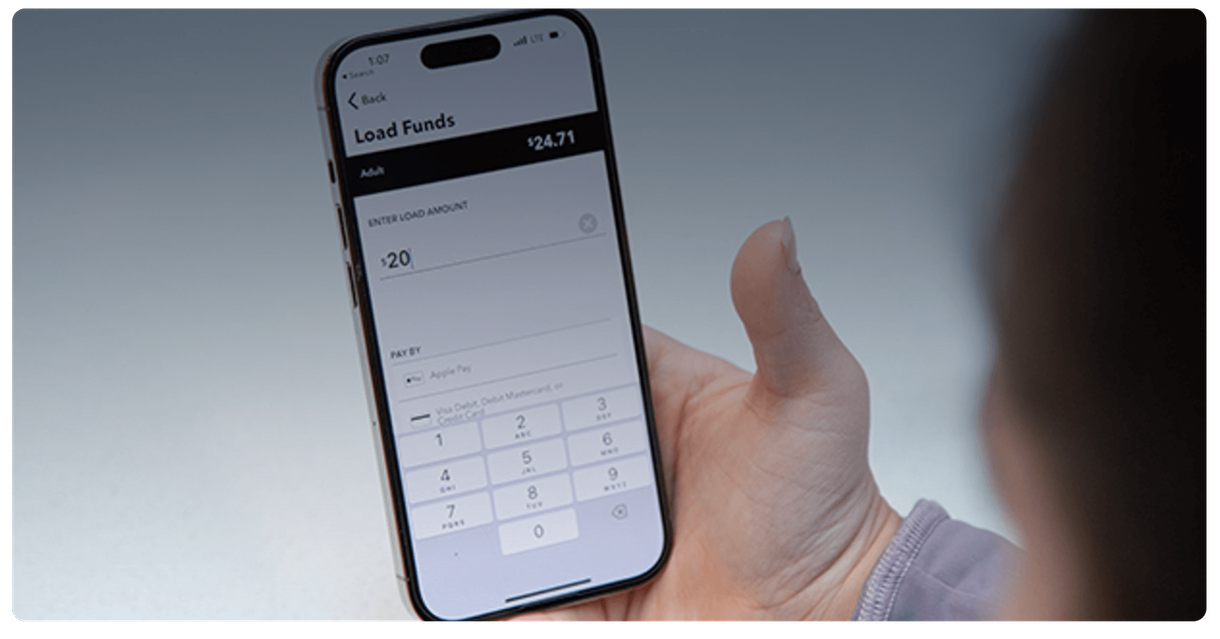 A phone showing the screen for loading funds onto a card