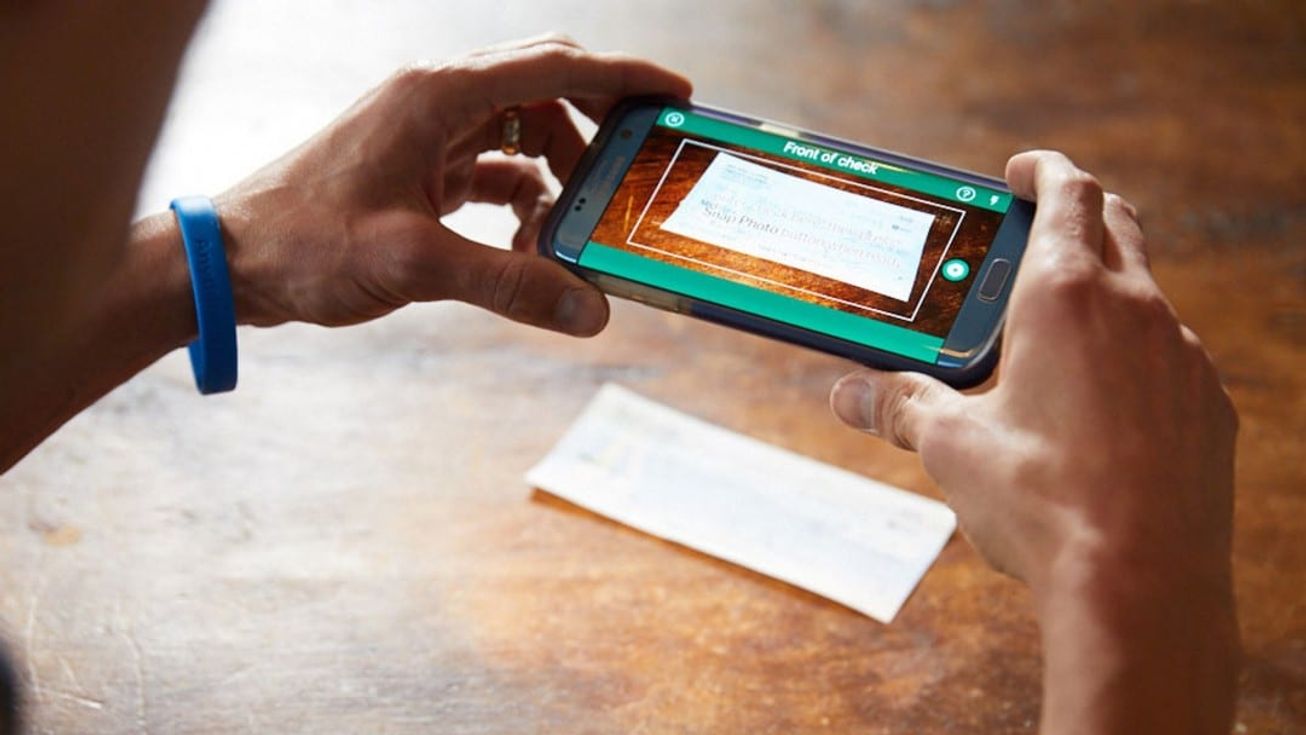 A phone camera captures a cheque for a mobile deposit
