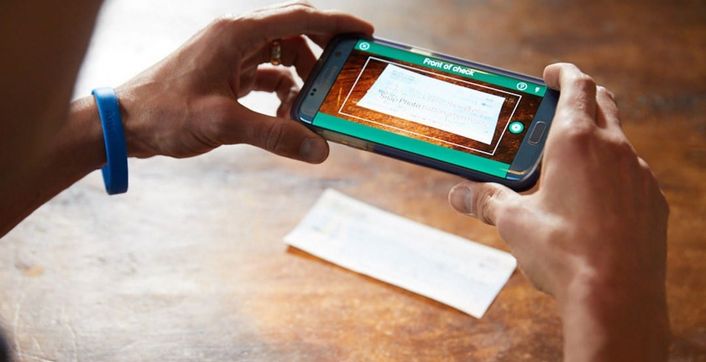 A phone camera captures a cheque for a mobile deposit