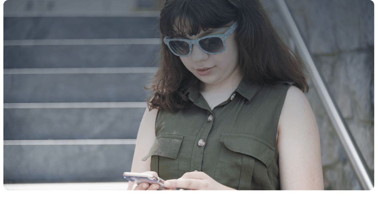 A rider looks at a phone