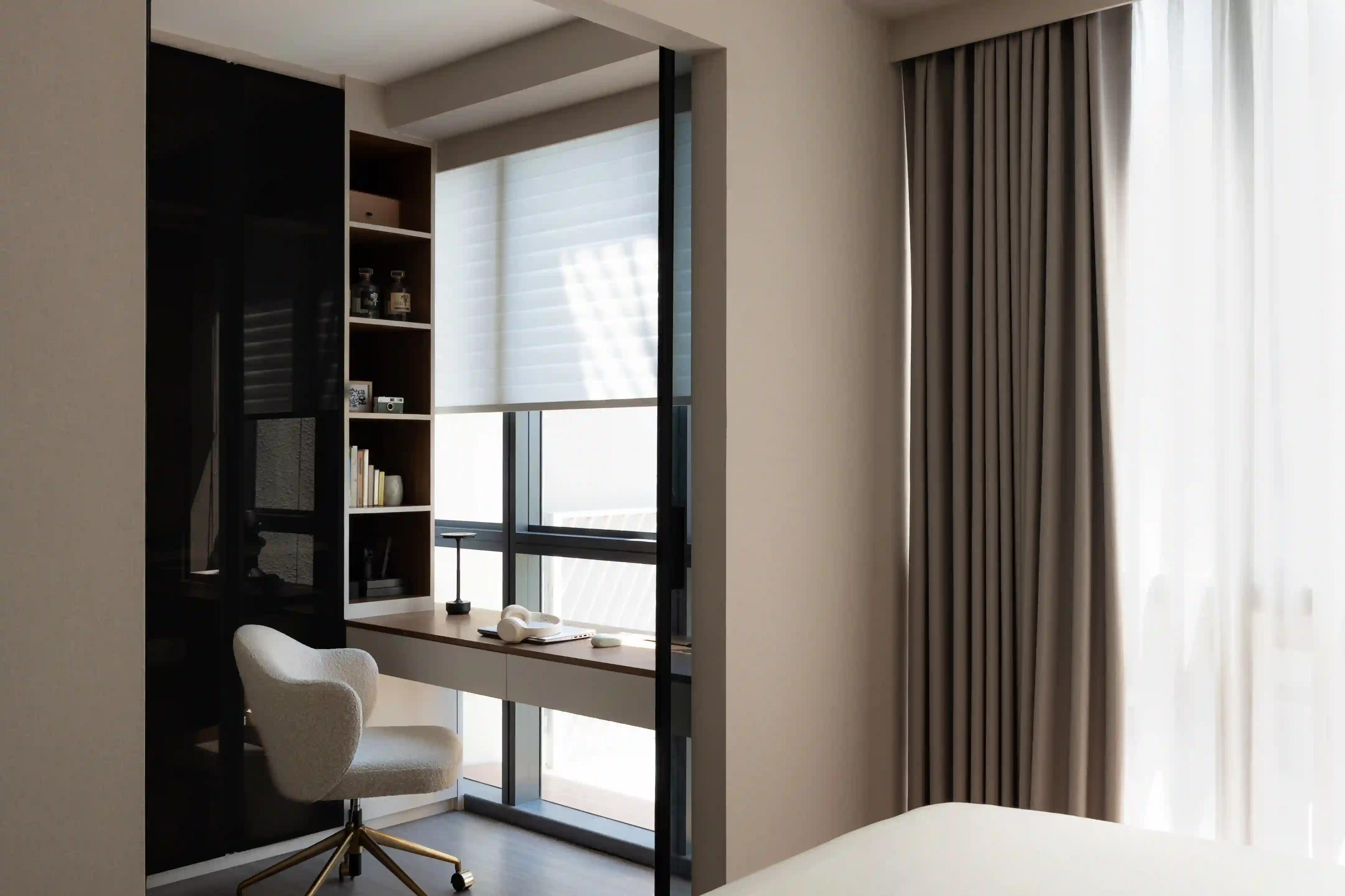 sunlit study nook by the window with built-in desk, shelves and boucle chair; practical interior decor singapore
