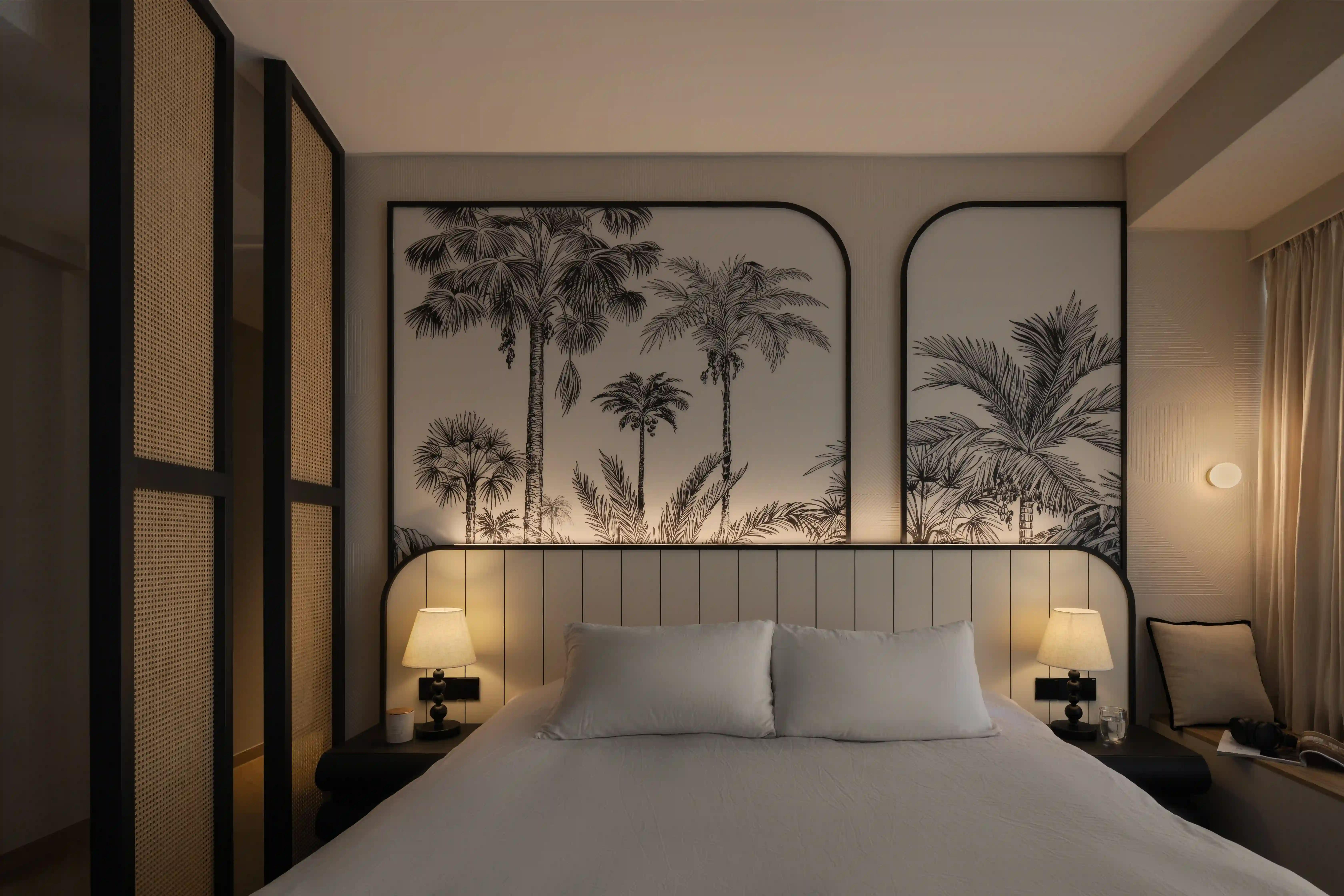 cozy bedroom with black-and-white tropical mural, cane screens and warm lamps; boutique interior decor singapore