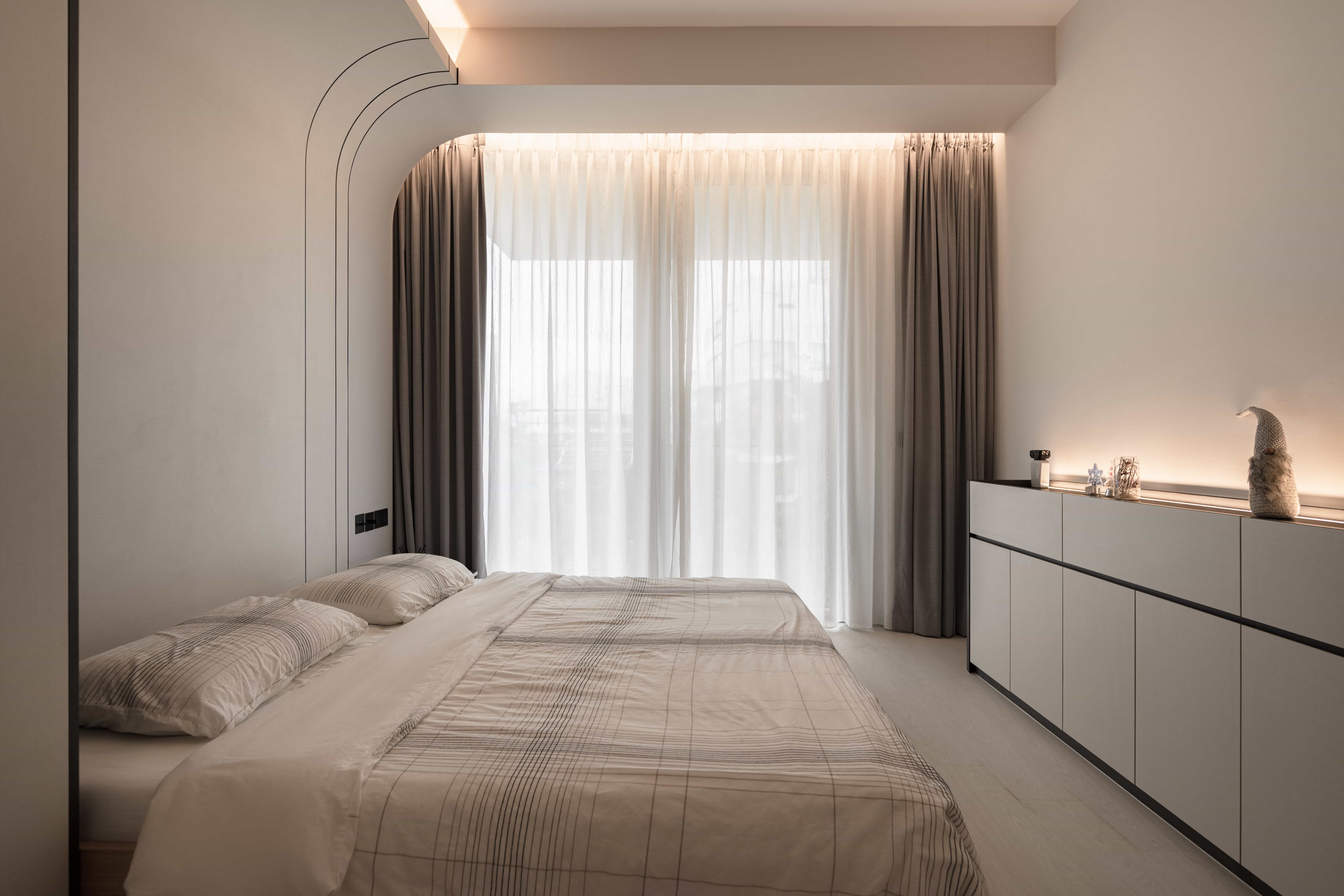 Monochrome modern bedroom with clean lines and a serene color palette.