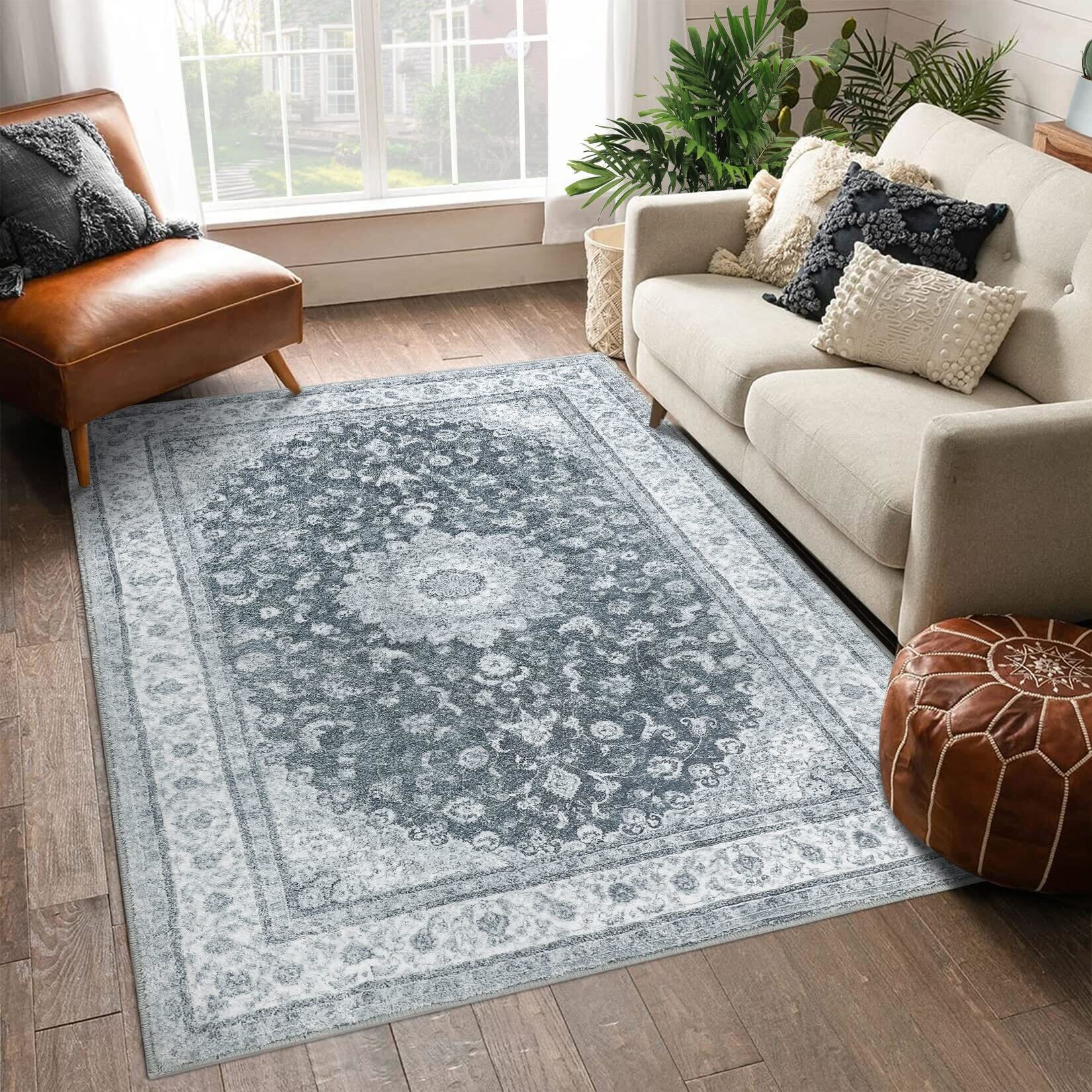 A traditional Oriental rug with intricate blue and white patterns in a cozy living room with light furniture and a leather armchair.