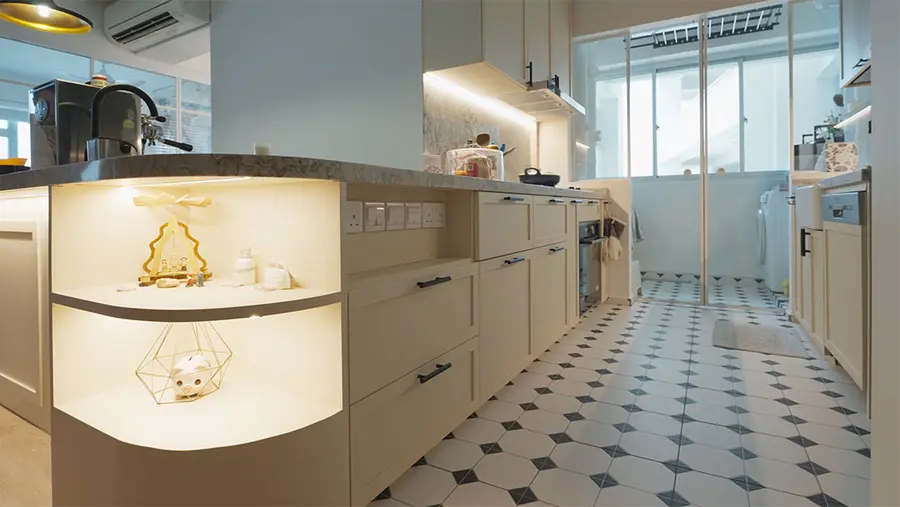 Rounded cream kitchen counter with inner lights to illuminate the space within the shelves