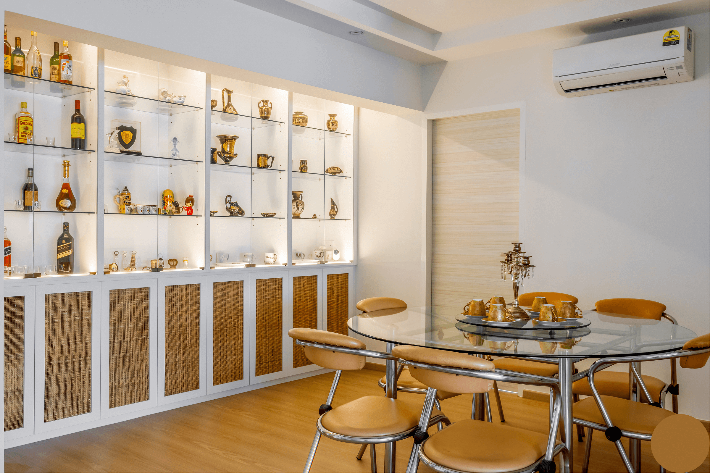 Spacious Dining Room with Vinyl Floor, Glass Table, Chairs, and Decorative Bottles on Display