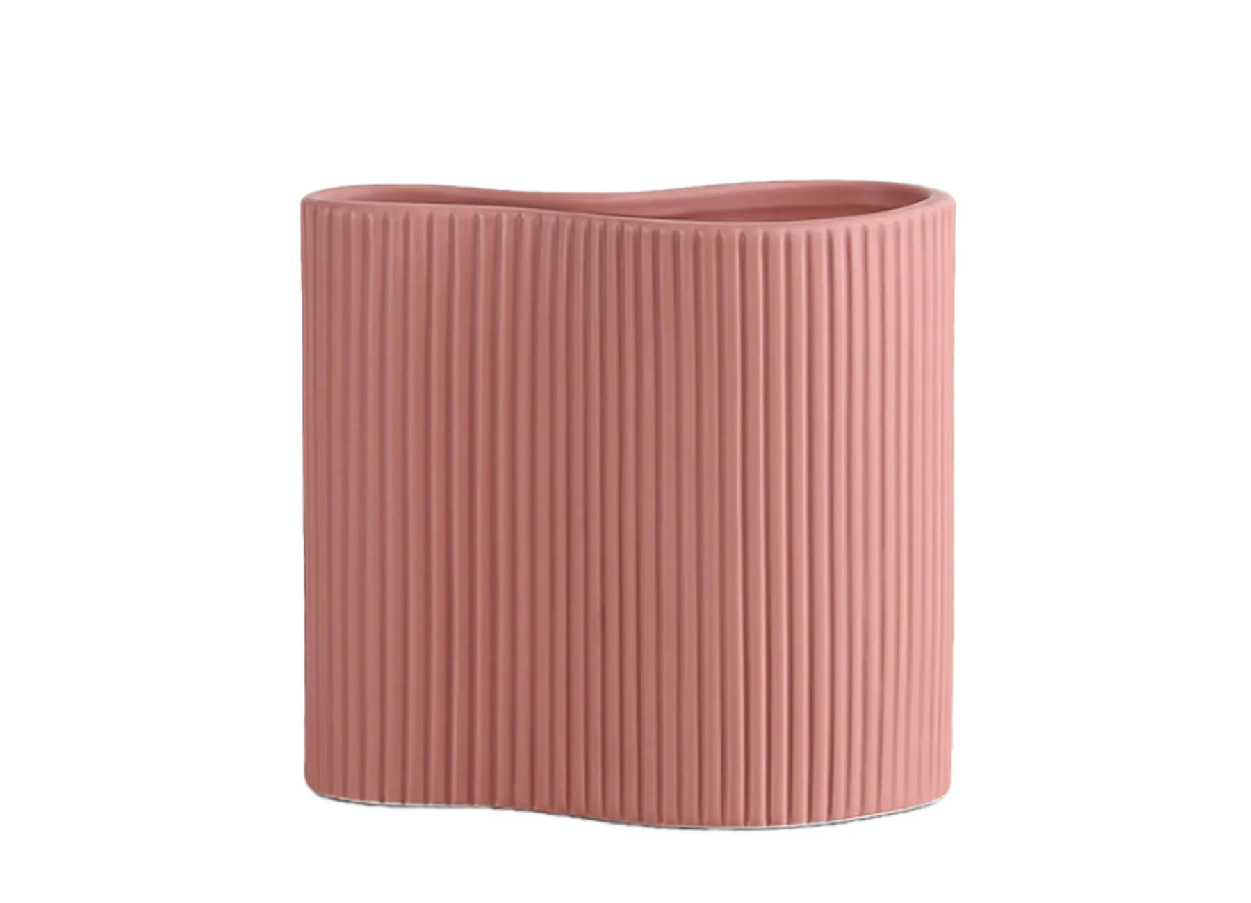 Peach Fuzz-inspired pleated ceramic vase from The Commune Life, adding a modern touch to interior design aesthetics