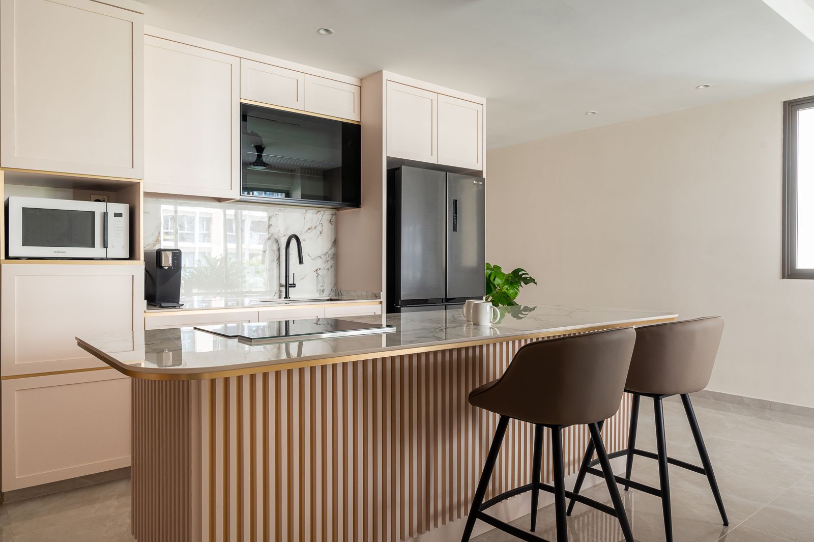 Contemporary Kitchen with Fluted Panels, White Cabinets, and Marble Countertops in Singapore Home