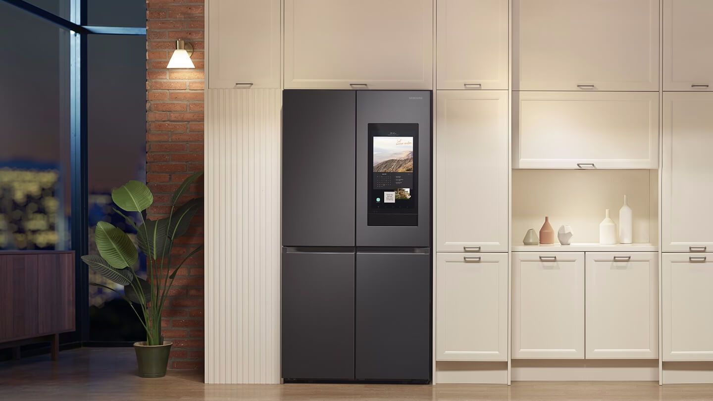 Samsung Family Hub smart refrigerator integrated in a modern kitchen with sleek cabinetry and ambient lighting, enhancing the smart home experience