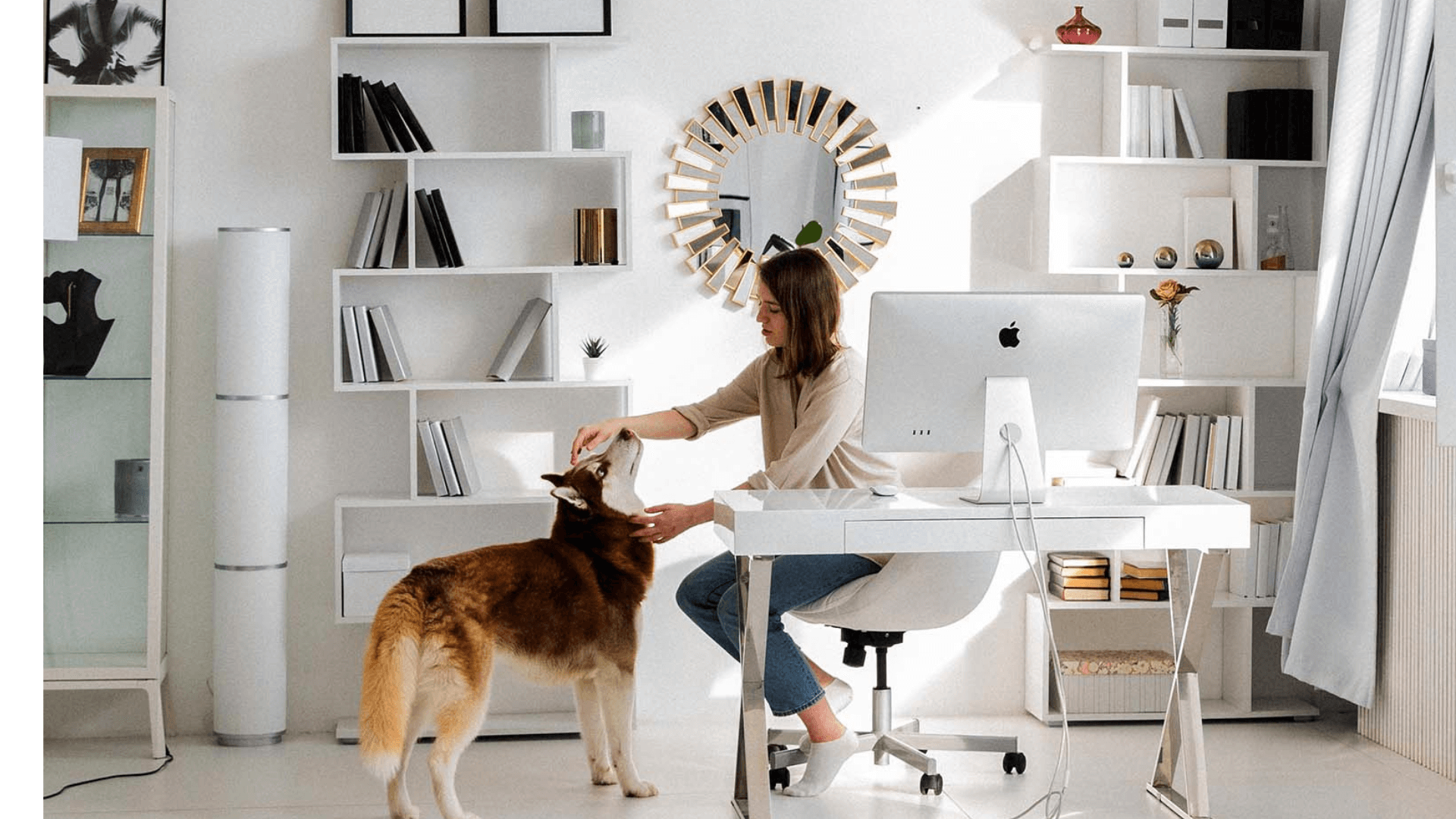 Home office with round mirror, bookshelves, and a bright workspace that promotes productivity and openness.