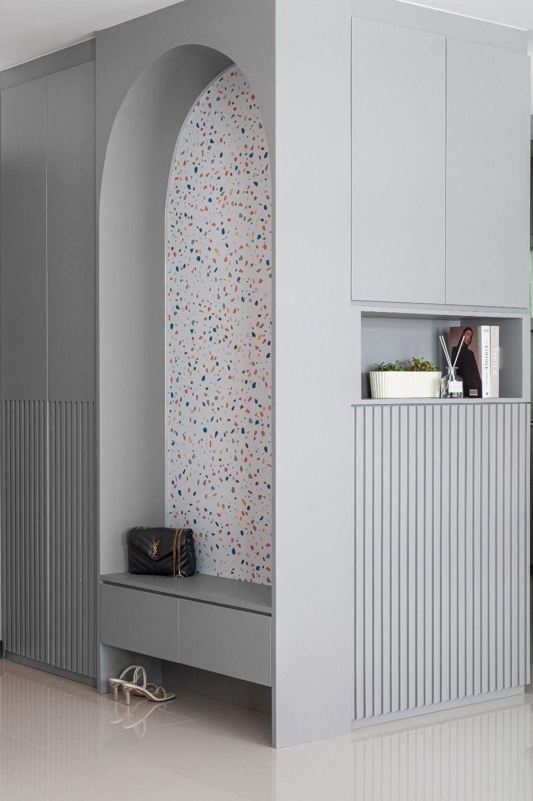 A stylish room with a Terrazzo tiled wall