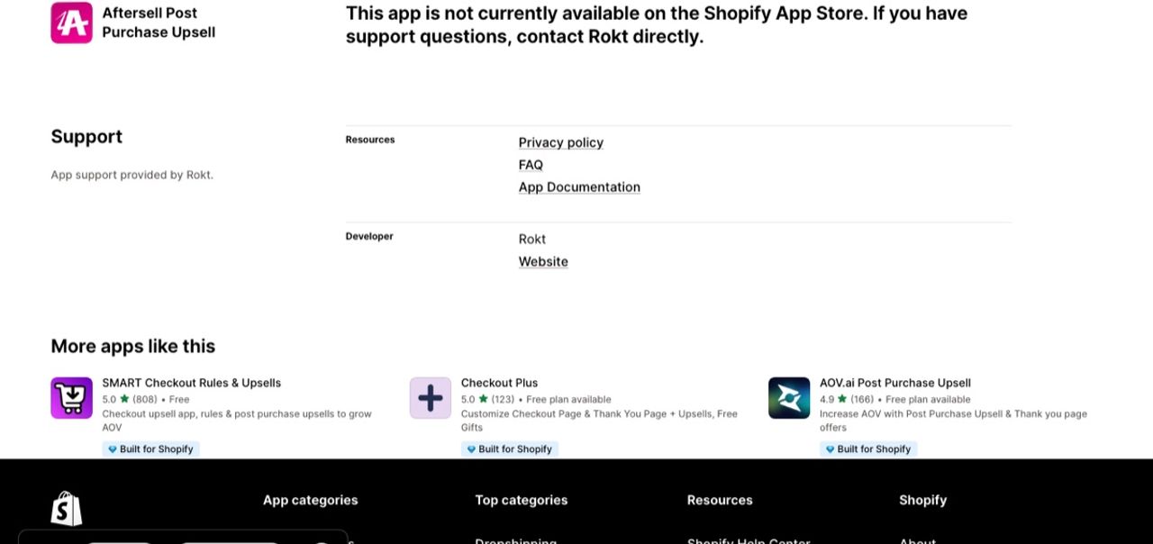 Aftersell Post Purchase Upsell page on the Shopify App Store reading "This app is not currently available on the Shopify App Store. If you have support questions, contact Rokt directly", with SMART Checkout Rules & Upsells, Checkout Plus and AOV.ai suggested underneath