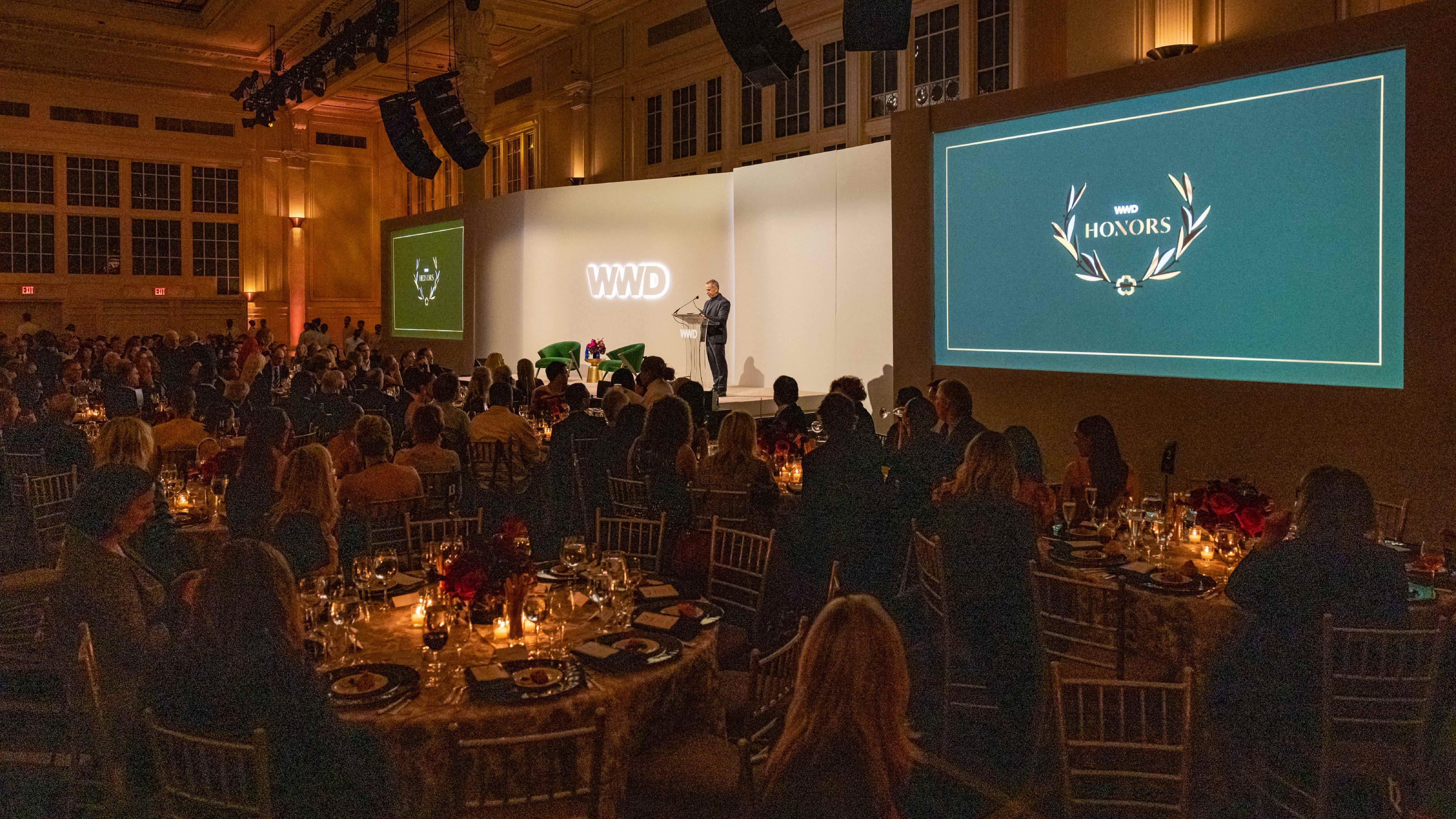 The main ceremony hall at WWD Honors with the branding on the large screens
