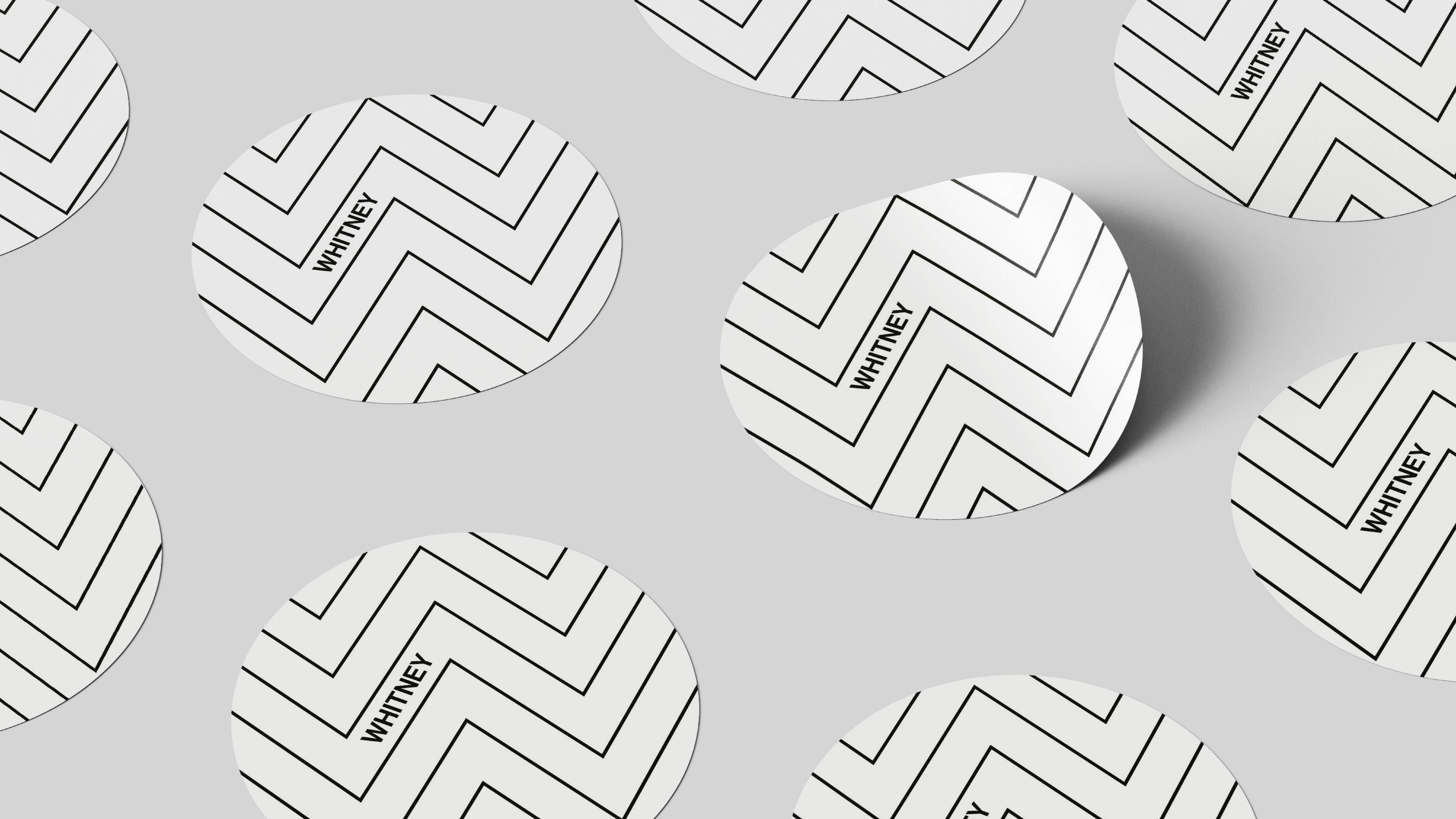 Round Whitney stickers on a grey background