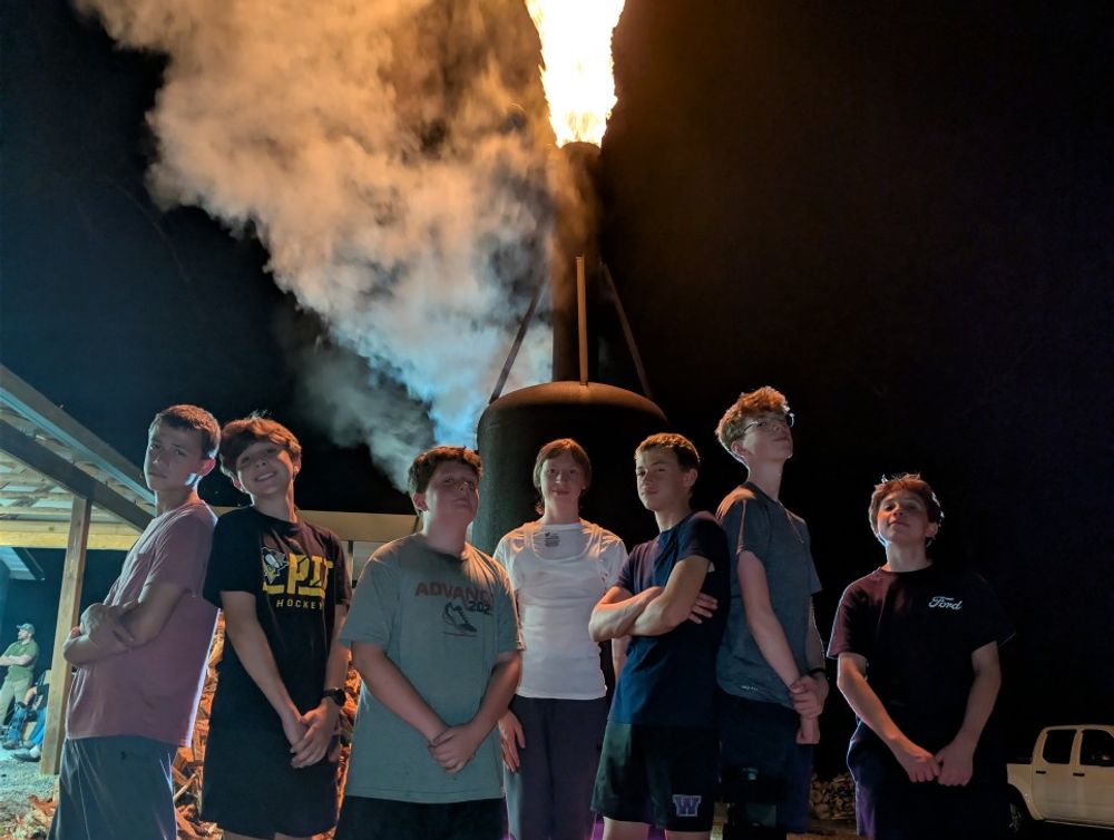 Scouts standing in front of our coal burner for BBQ