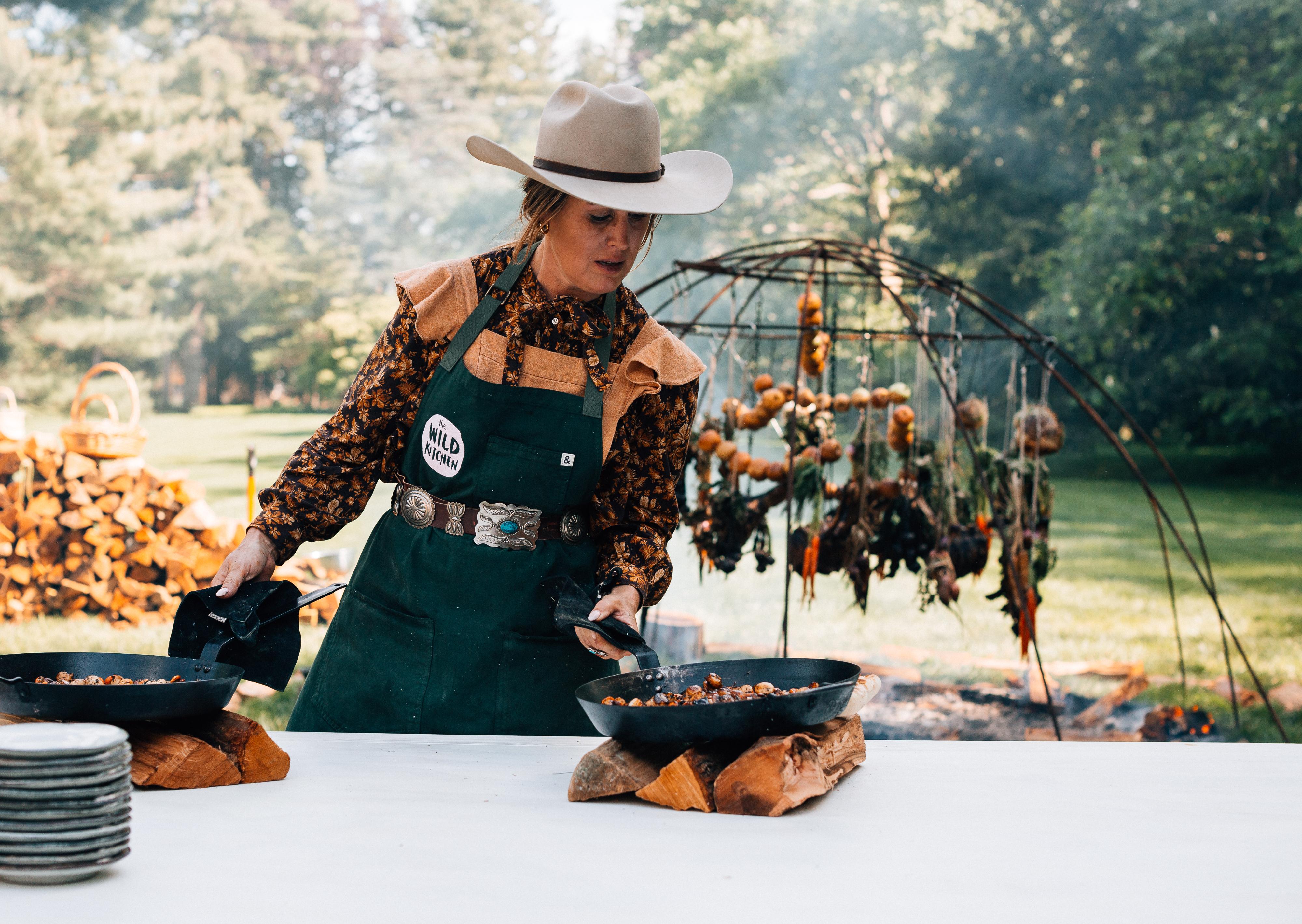 Sarah Glover cooking outdoors.
