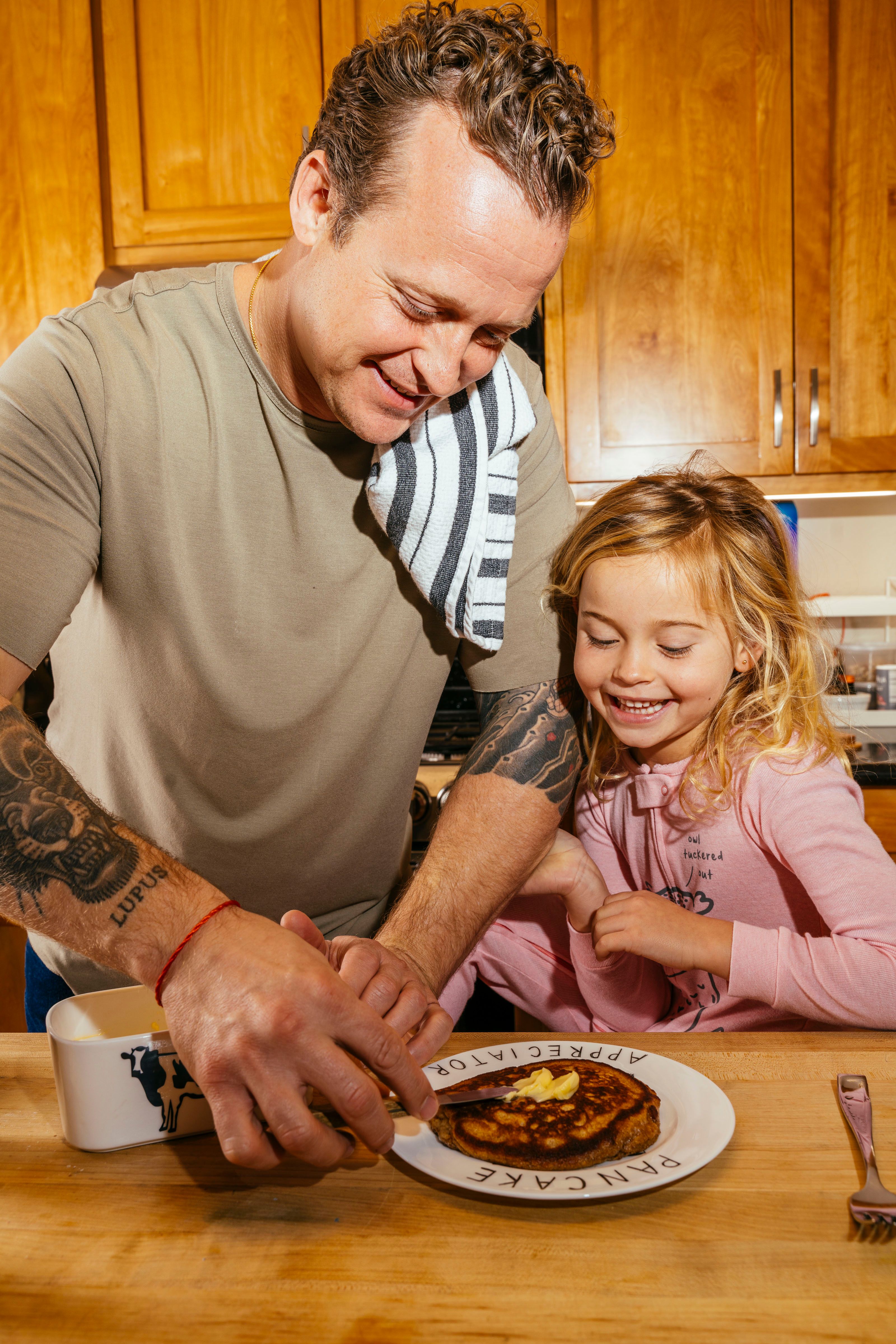 David Nayfeld and his daughter cooking together.