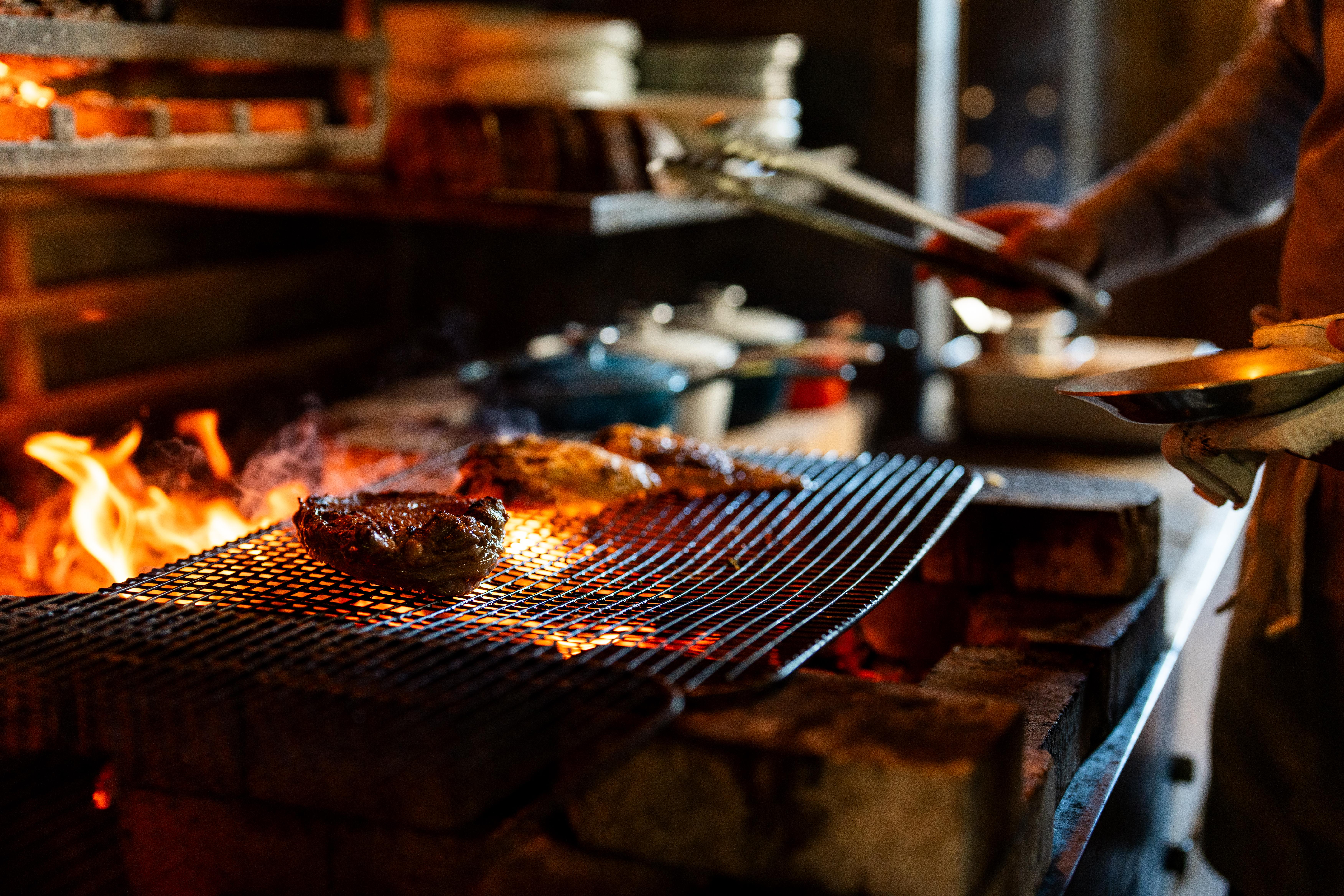 Steak over hearth grill.