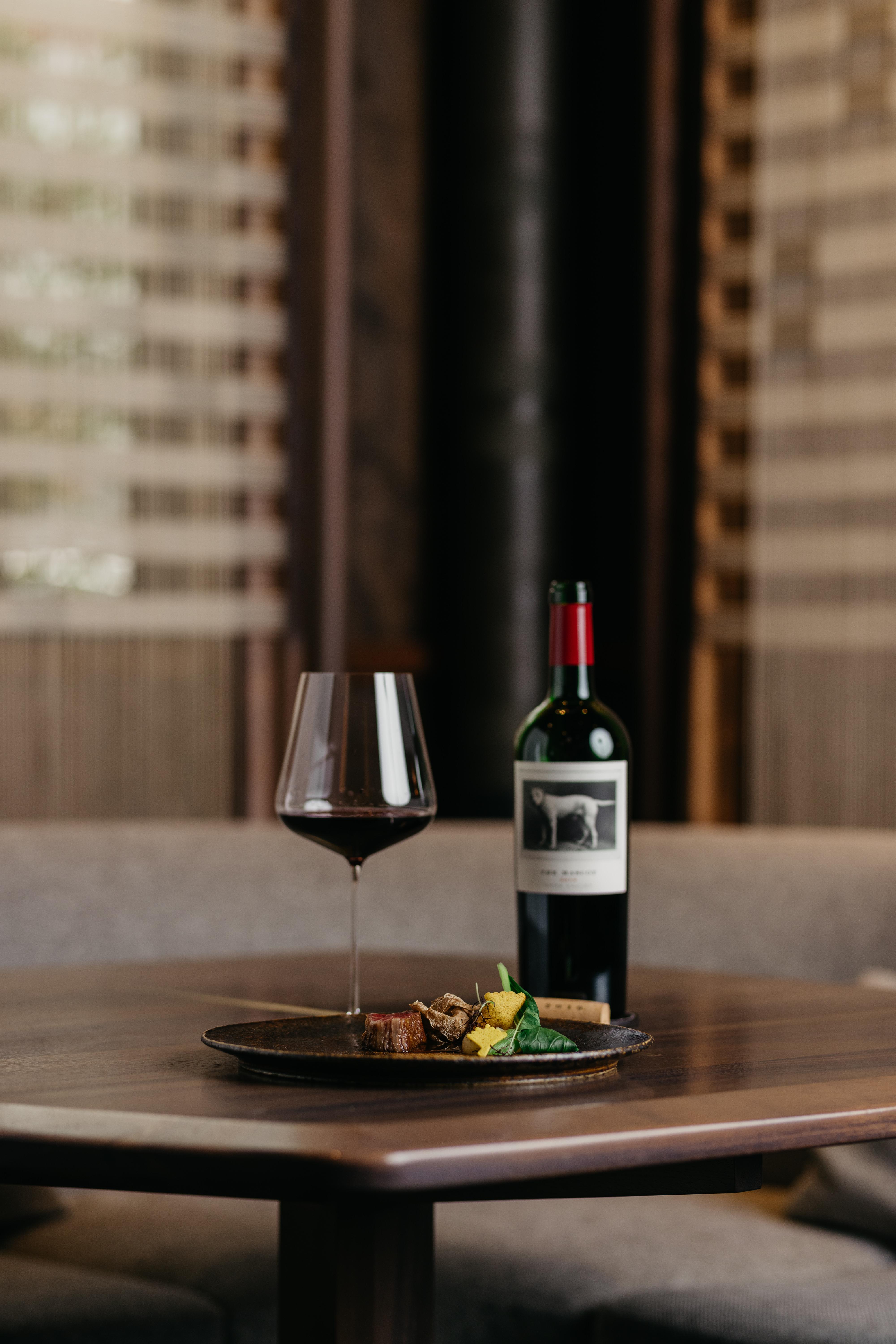 the mascot and wine pouring