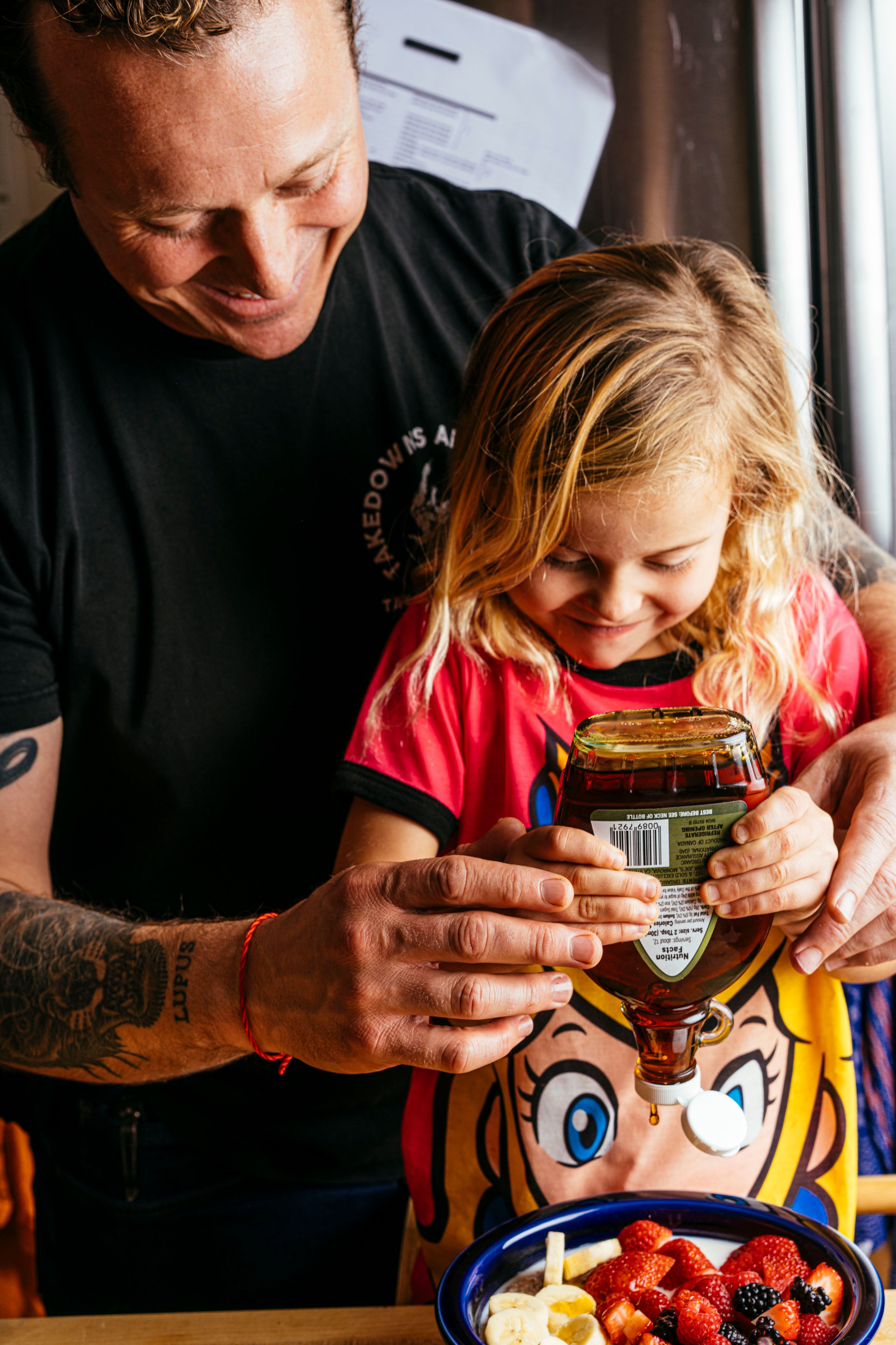 Chef David Nayfeld cooking with his daughter.