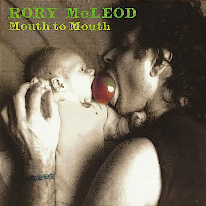 Mouth to Mouth Cover, Rory and baby lying down both biting the same apple.