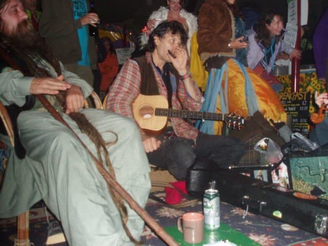Rory playing harmonica at a party.
