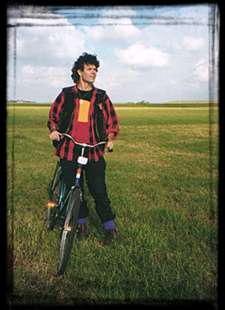 Rory on a bike in a field.