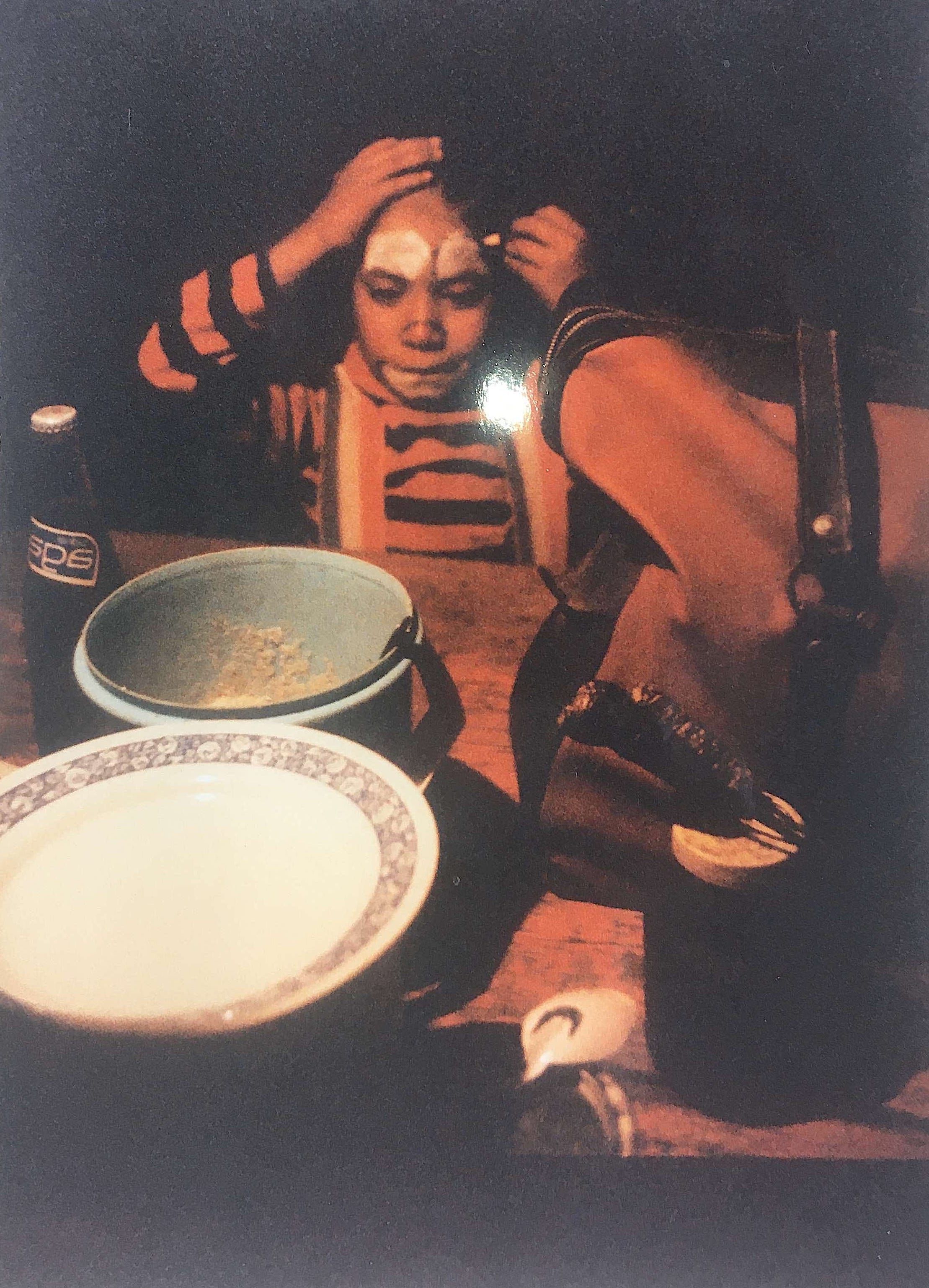 Young Gustavo (son of Victor) putting clown make up on Circo ideal on tour in Nayarit Jalisco Mexico. 1979.