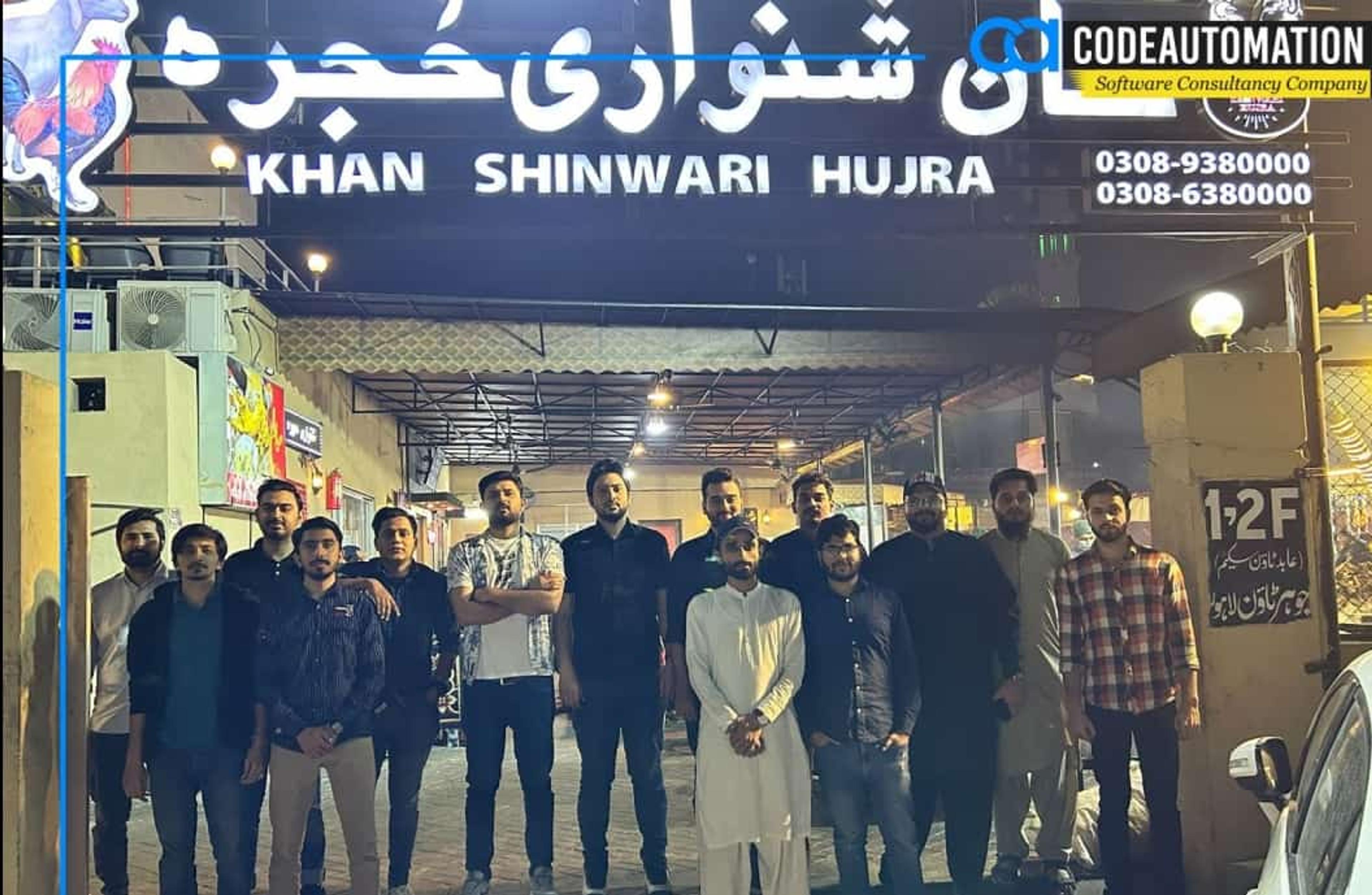 CodeAutomation’s Pakistan Chapter team, including the CEO, enjoying an outdoor dinner together, reflecting the company’s collaborative culture and global reach.