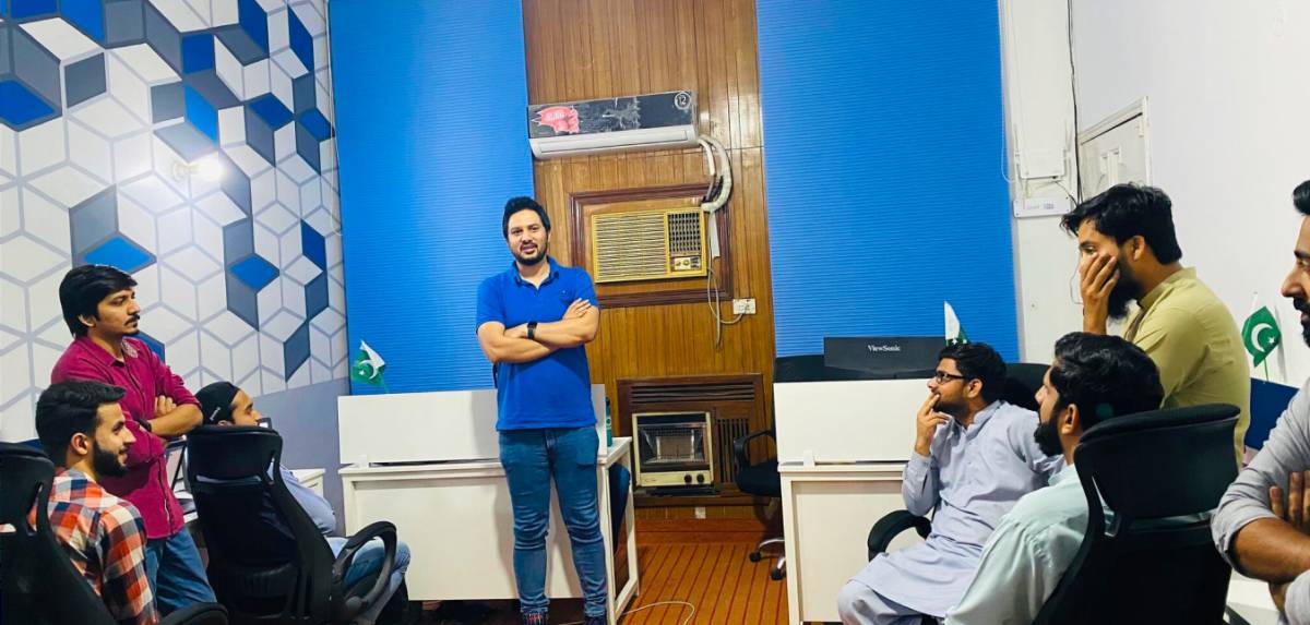 CodeAutomation CEO Adnan Ghaffar delivering a motivational lecture to employees, reflecting the collaborative spirit of Life at CodeAutomation.