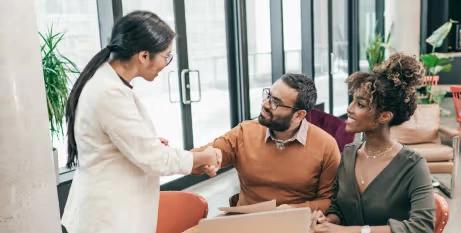 Office team discussing CRM customization and automation solutions at CodeAutomation.ai, US-based software company specializing in GHL CRM services, business automation, and AI agent development