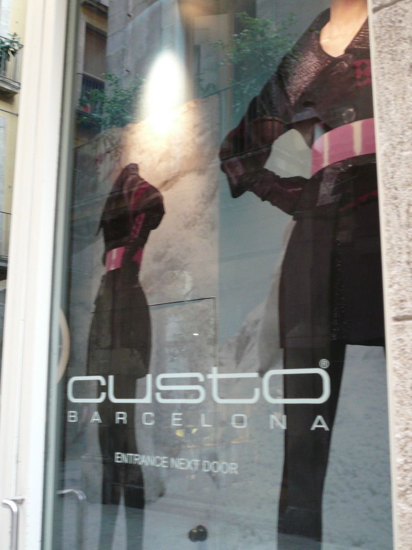 Detail of exterior graphics and Custo Barcelona logo on a shop window