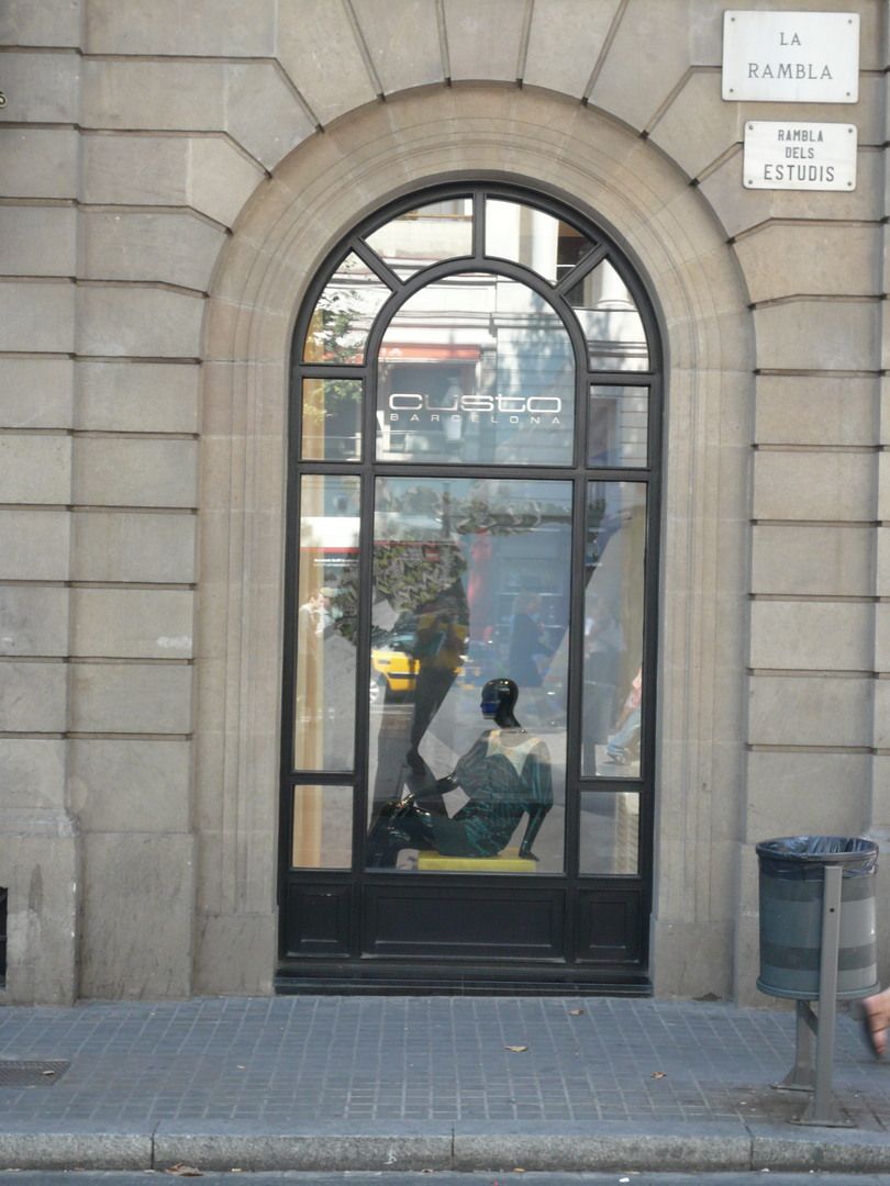 Custo Barcelona shop window on La Rambla with brand identity visible from the street