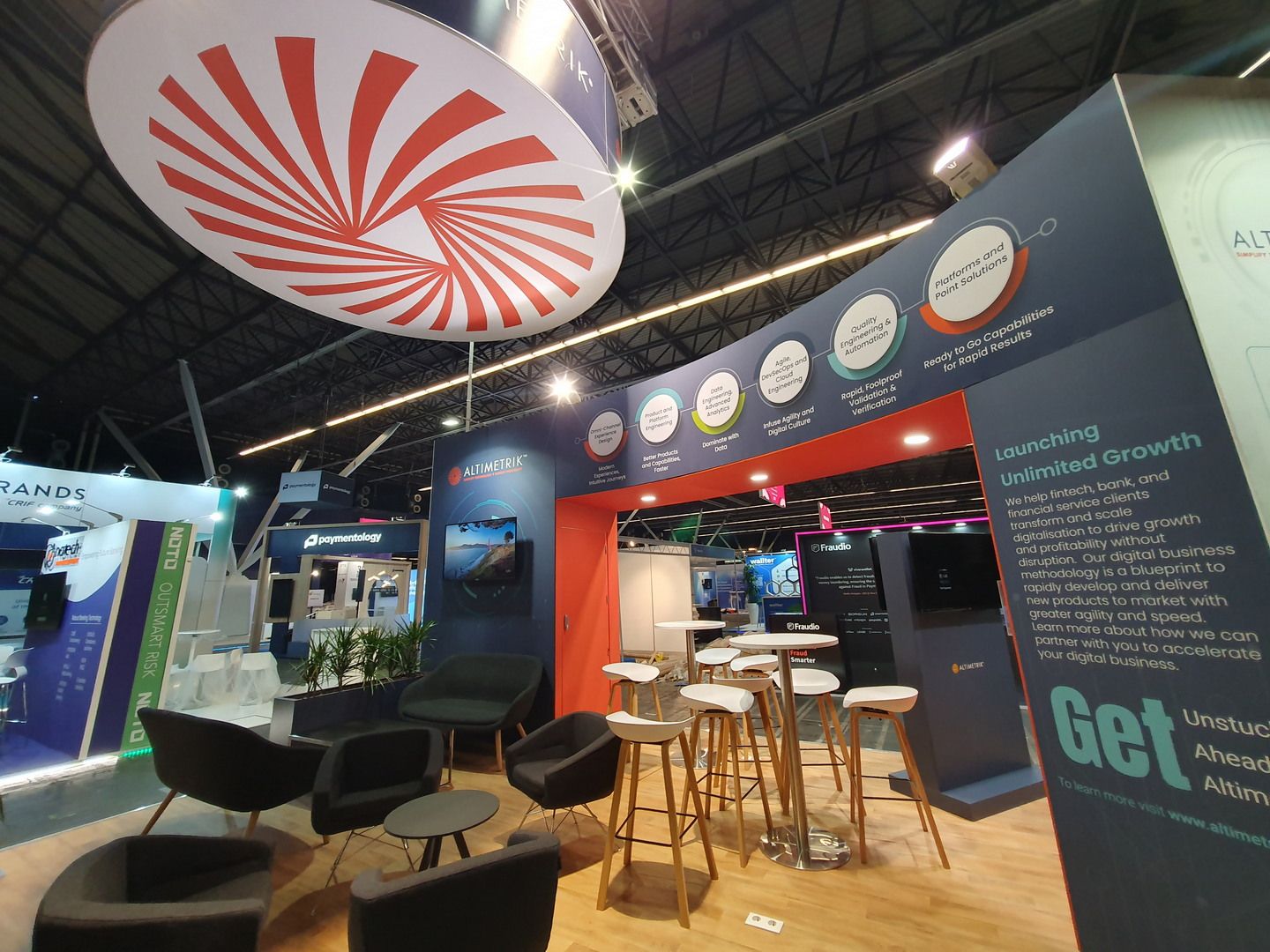 Altimetrik stand at Money20/20 Europe 2022 in Amsterdam with a large suspended circular structure