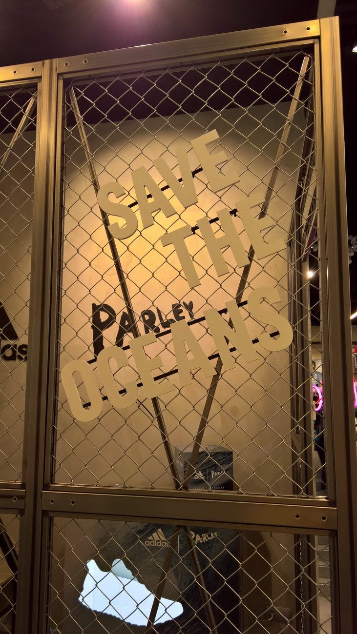Detail of the graphics and timber frames — Adidas · Store Barcelona
