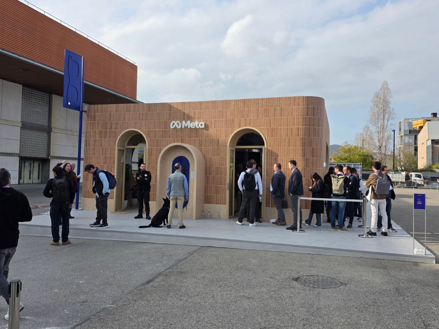 Meta outdoor pavilion during MWC Barcelona 2026 with visitors beside the ceramic facade