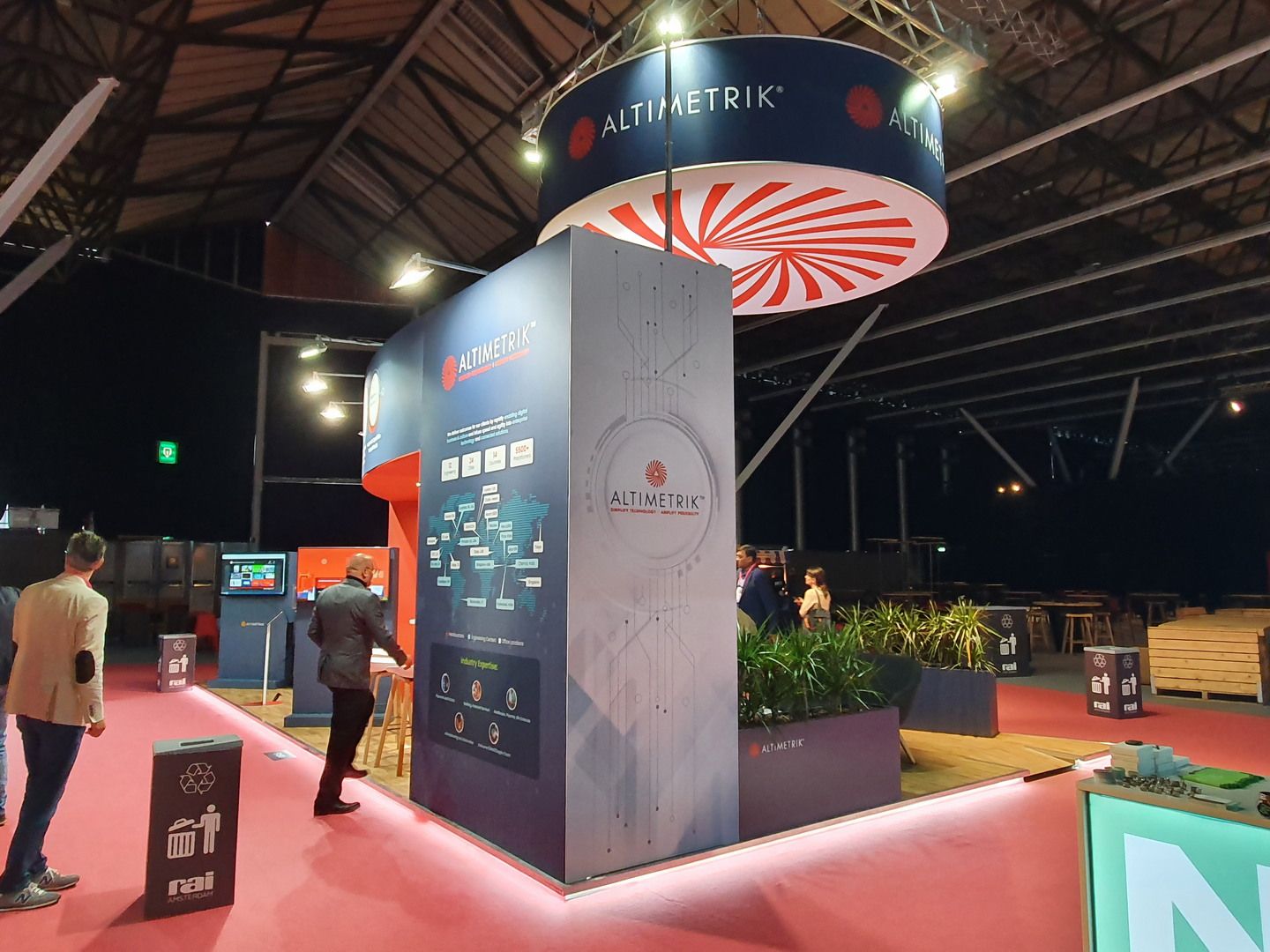 Detail of the Altimetrik stand in Amsterdam with brand identity and technology features