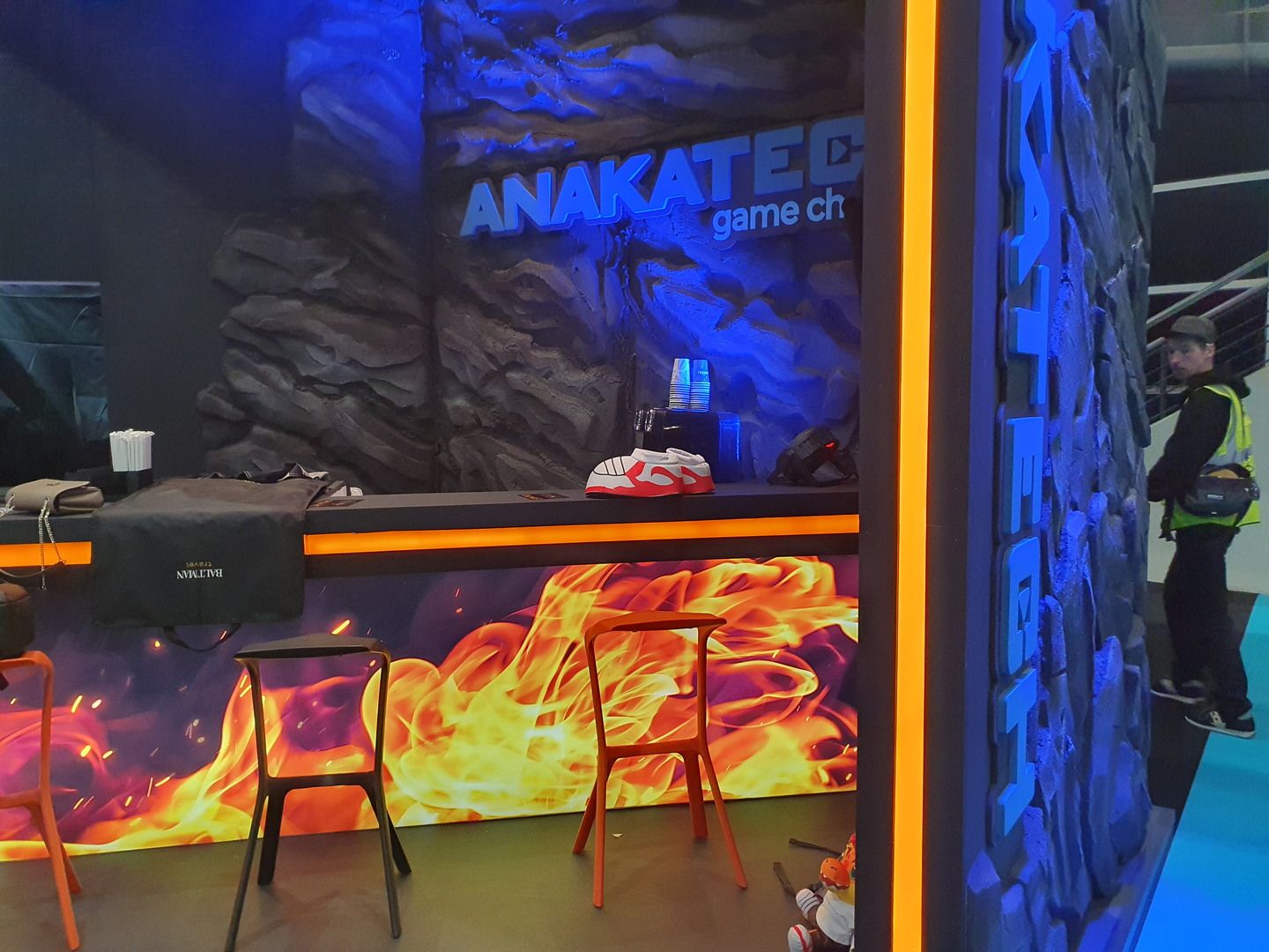 Counter with flame graphics and Anakatech rock-effect backdrop