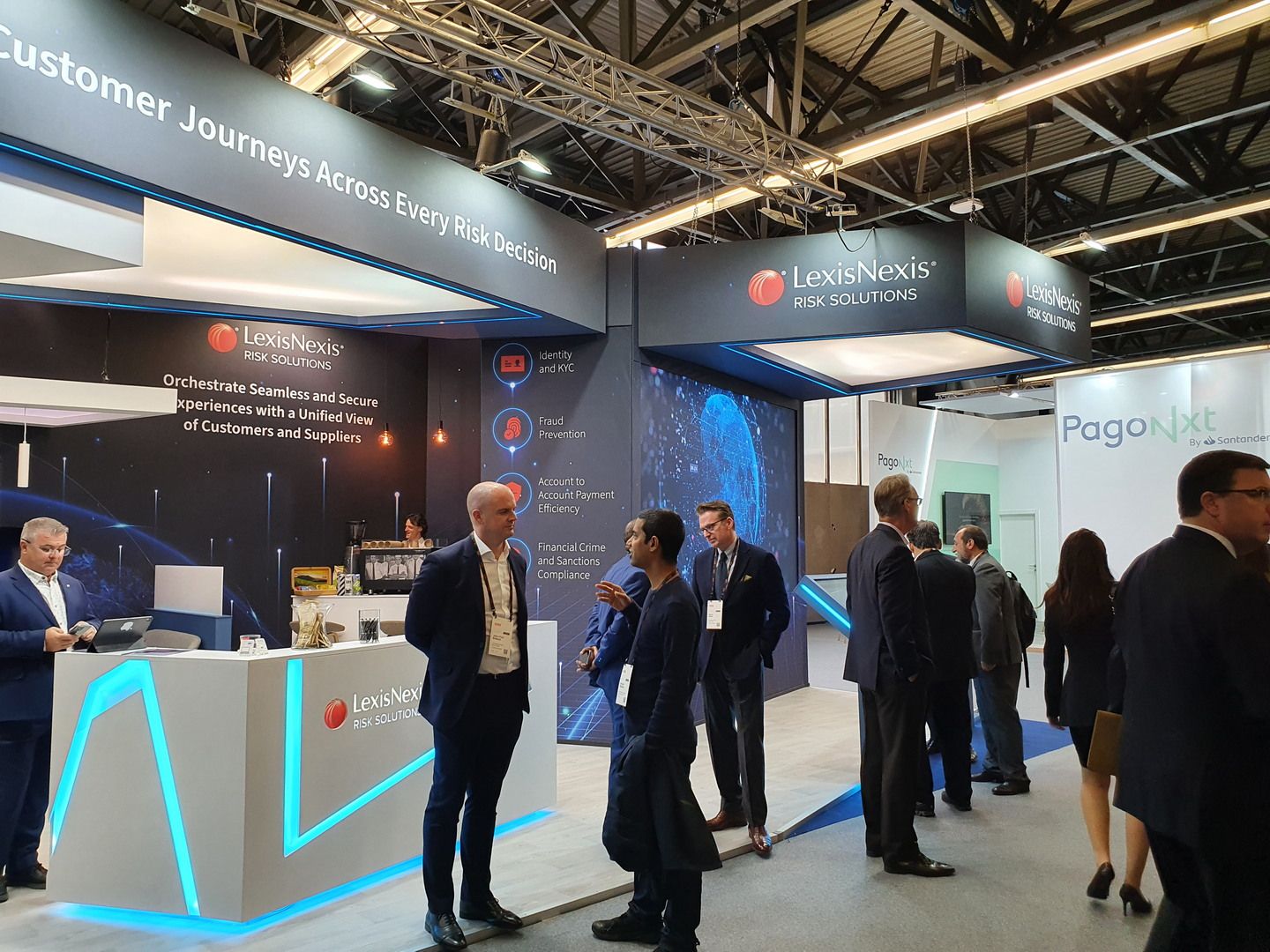 Detail of the LexisNexis exhibition stand design at SIBOS Amsterdam with integrated lighting and interactive areas