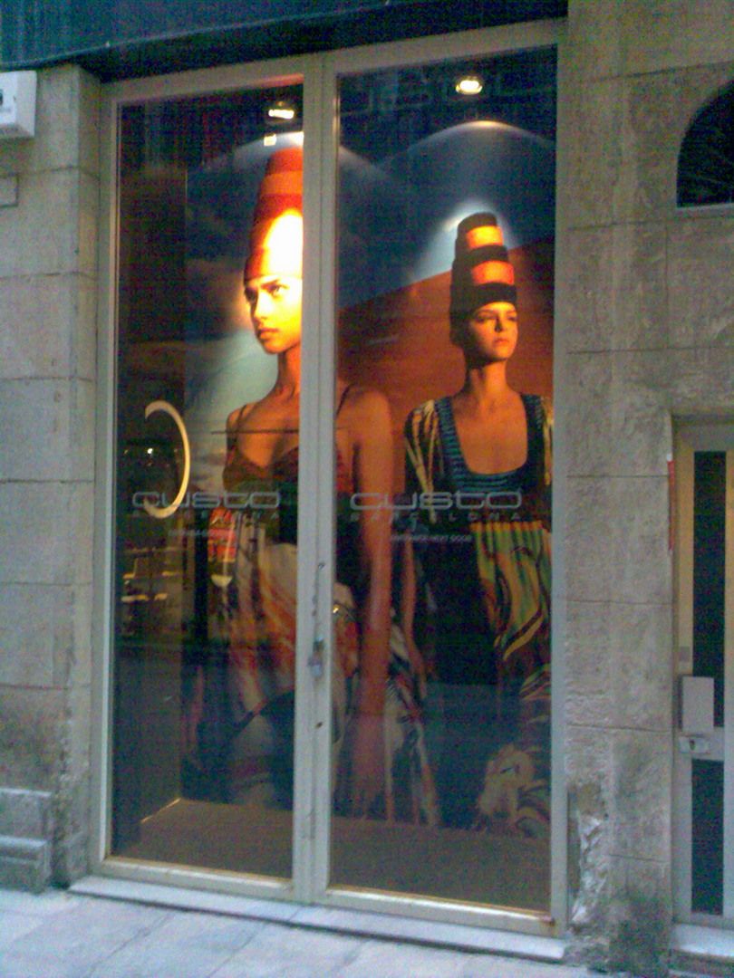 Custo Barcelona shop window with fashion campaign graphics applied to the glass