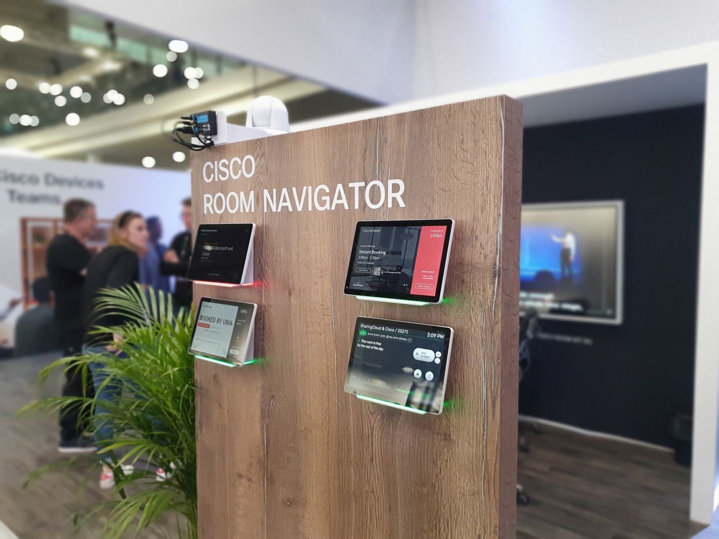 Cisco Room Navigator devices integrated into timber panels — Cisco Webex · ISE